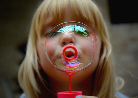 Girl blowing a bubble