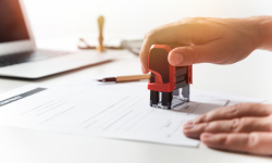 hand stamping a piece of paper